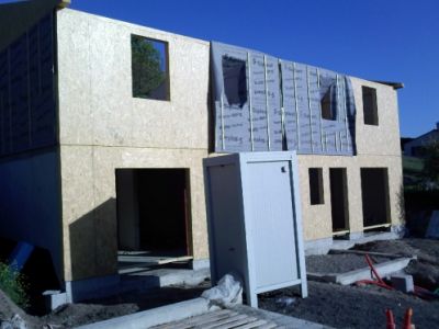 Maison ossature bois, bardage bois et enduit sur isolation par l’extérieur 6