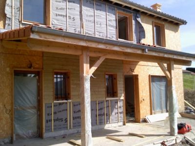 Maison ossature bois, bardage bois et enduit sur isolation par l’extérieur 11