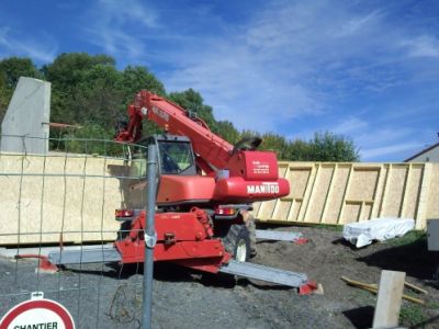 Maison ossature bois, bardage bois et enduit sur isolation par l’extérieur